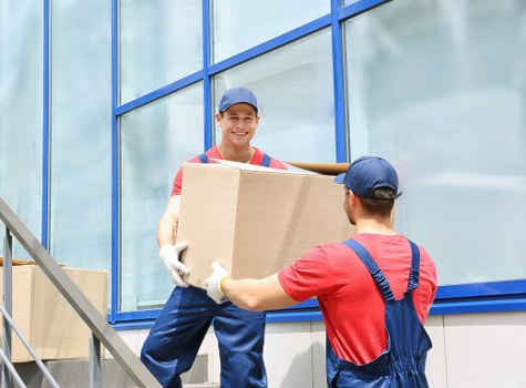 Urgent removals team loading items in a Notting Hill street