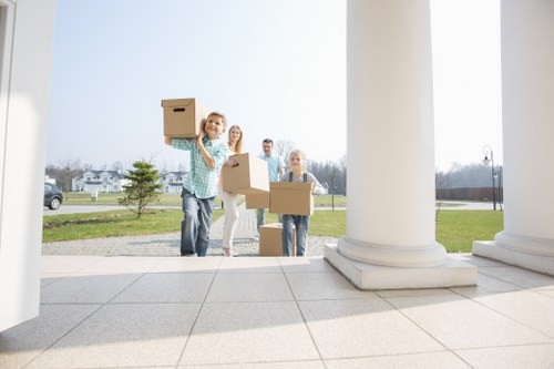 Professional piano movers planning access in a Notting Hill home