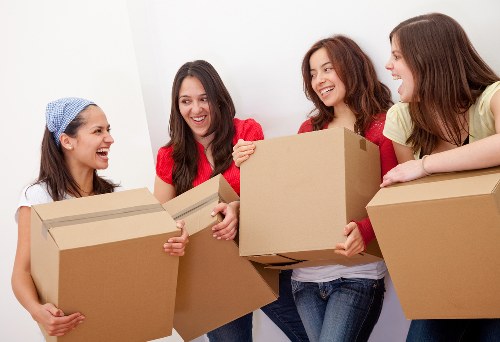 Furniture removal team handling a move on a Notting Hill street