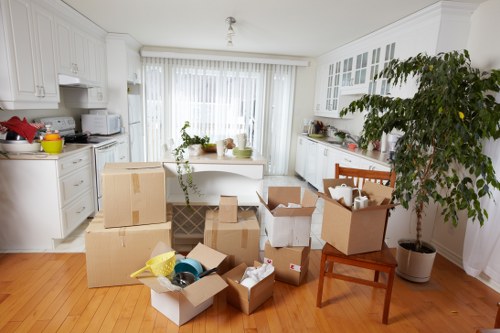 Boxes and furniture being carried from a London apartment building