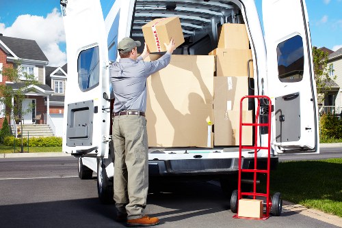 Careful wrapping and loading of household furniture for local relocation