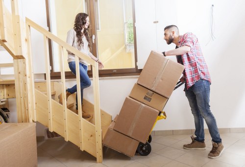 Office furniture and equipment being prepared for transport
