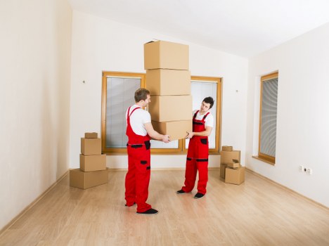 Professional movers handling a flat removal in Notting Hill